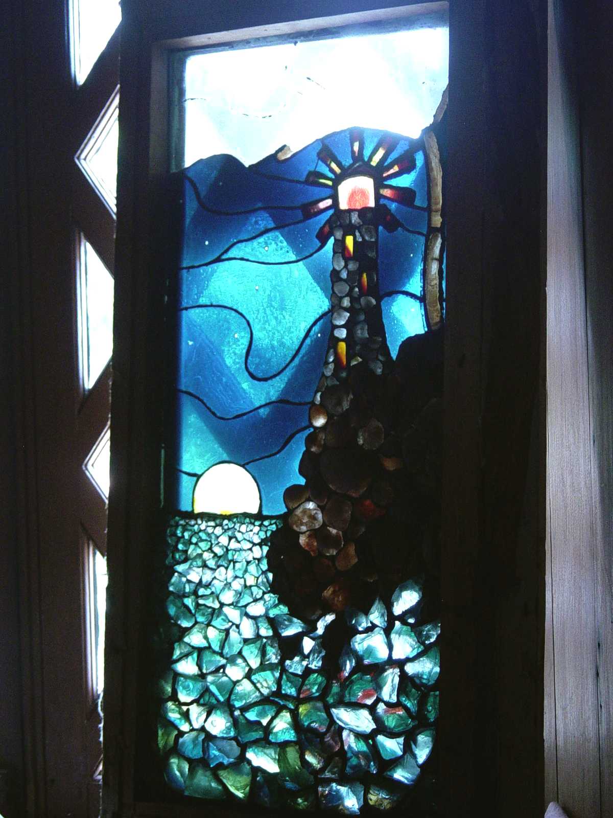 Stained glass window at end of upstairs hall