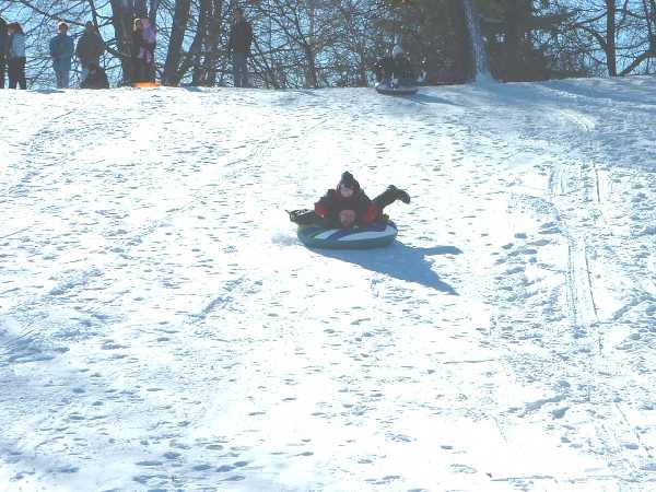 Geoffrey and John sledding